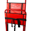 A close-up of the UltraFire Descender evacuation chair showing the red seat back, printed branding, and attached black straps.