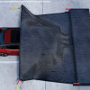 lithco electric vehicle blanket partially covering a red car in use viewed from above in a parking area