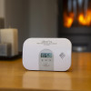 Close up of ultrafire ubco1d carbon monoxide alarm with display showing temperature reading on table