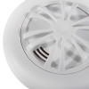 Closeup of the sounder on an ultrafire battery heat alarm showing the grille design and white casing